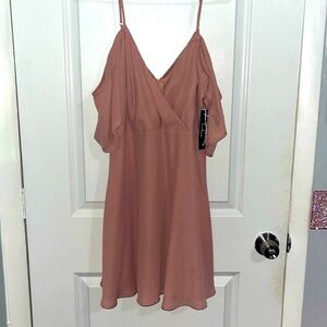 Beautiful dress with straps and cold shoulder. Frilly and cute. NWT